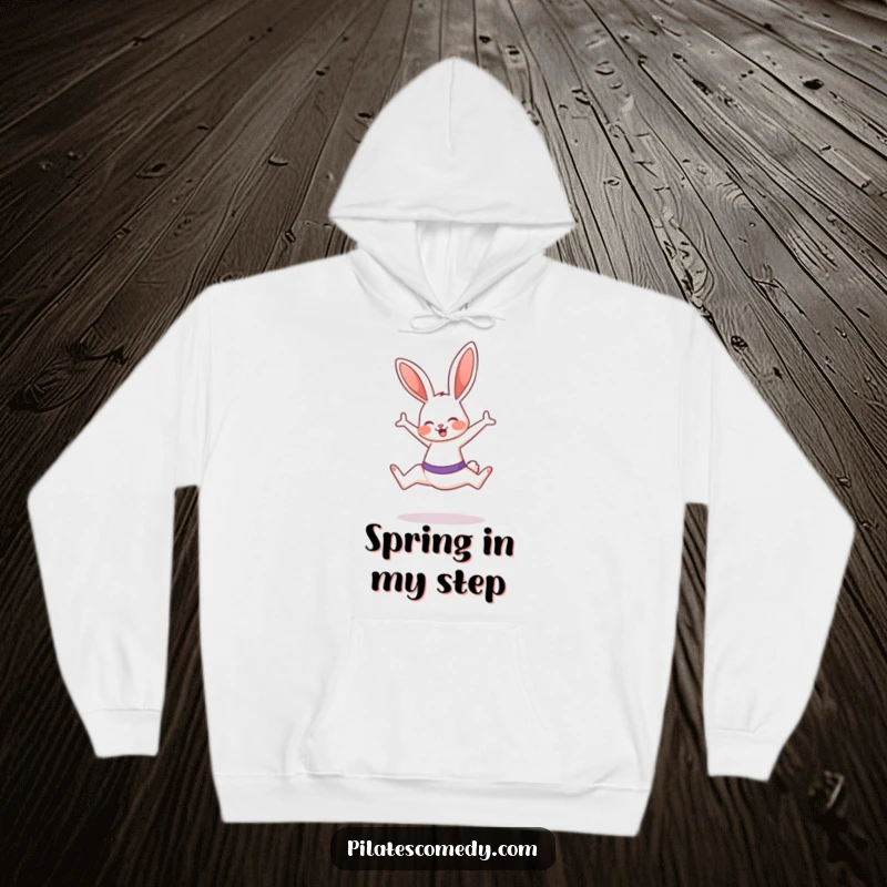 Funny bunny design on a cozy hoodie, bunny is doing a Pilates leap with a smile, perfect for fitness lovers.