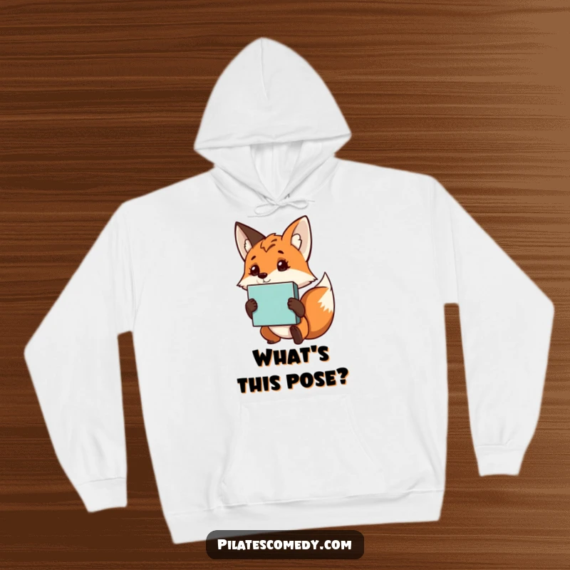 Funny fox hoodie featuring a curious character holding a yoga block, perfect for staying warm during or after yoga sessions.