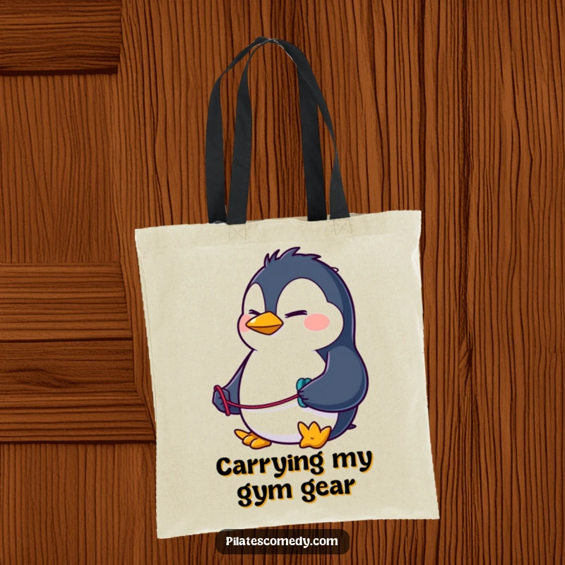 Funny penguin tote bag with a determined character using a resistance band, perfect for carrying gym clothes and accessories.