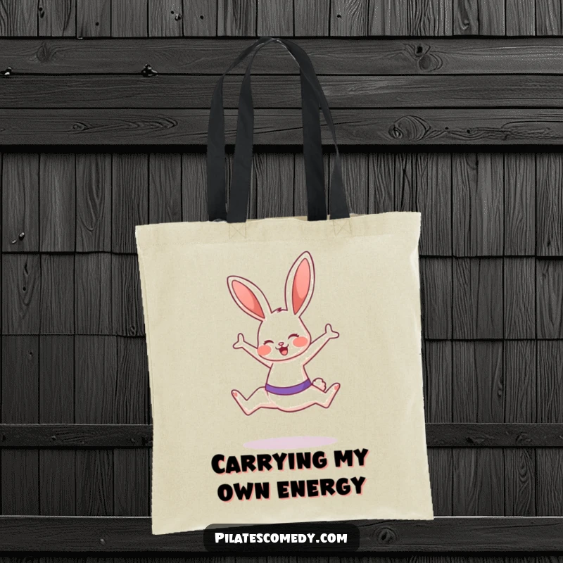 Funny bunny illustration on a tote bag, mid-Pilates leap with a smile, perfect for gym or everyday carry.